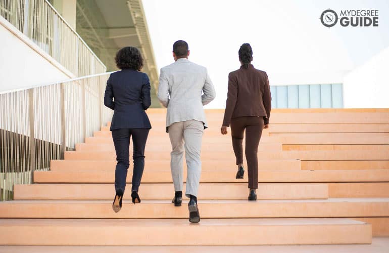 professionals walking towards a building