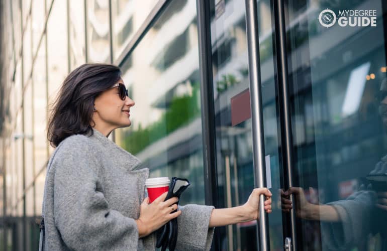 a female professional walking into a clinic