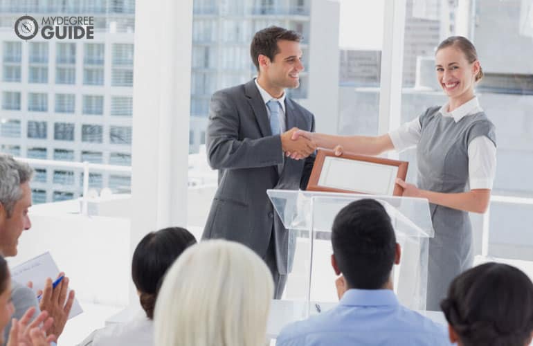 accountant receiving a certificate