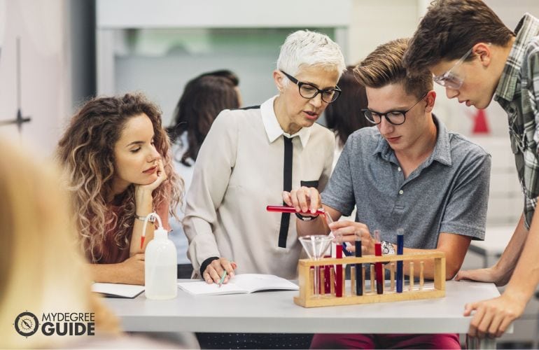 High School Chemistry Teacher guiding her students