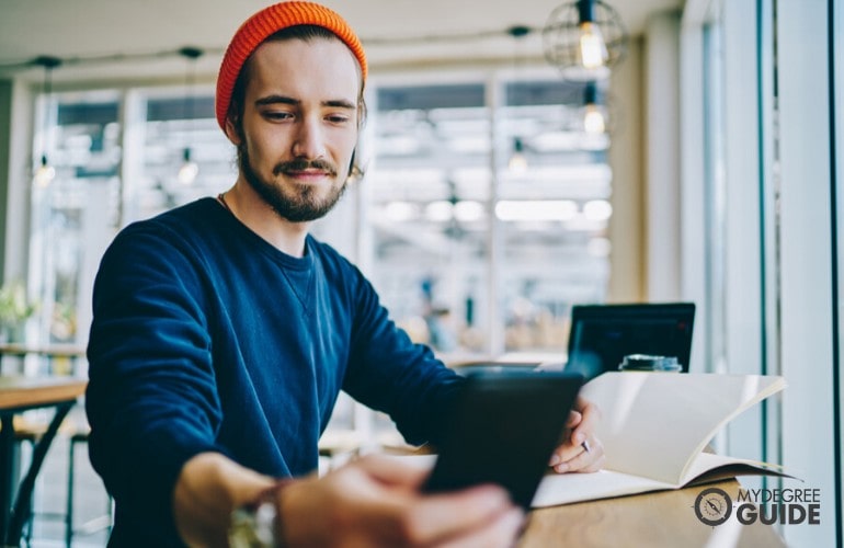 liberal arts degree student studying at a cafe