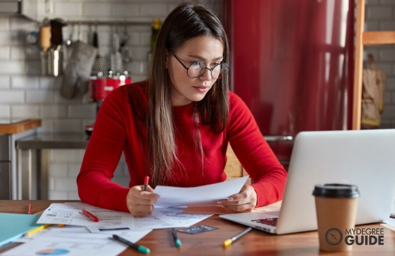 Master’s in Healthcare Management Degree student studying at home