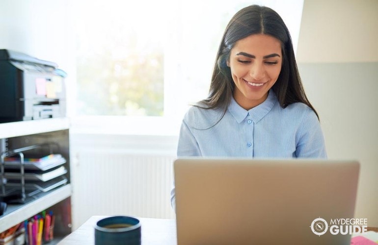 Master’s in Public Administration Degree studying on her laptop