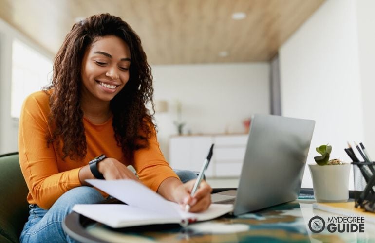 A working student, answering her homework