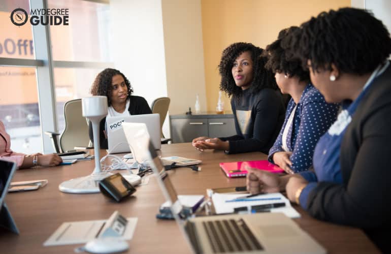 businesswomen discussing an upcoming talk