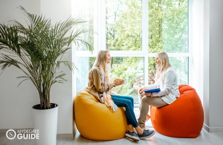 psychologist talking to a patient during therapy session