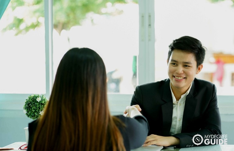 people shaking hands after an interview