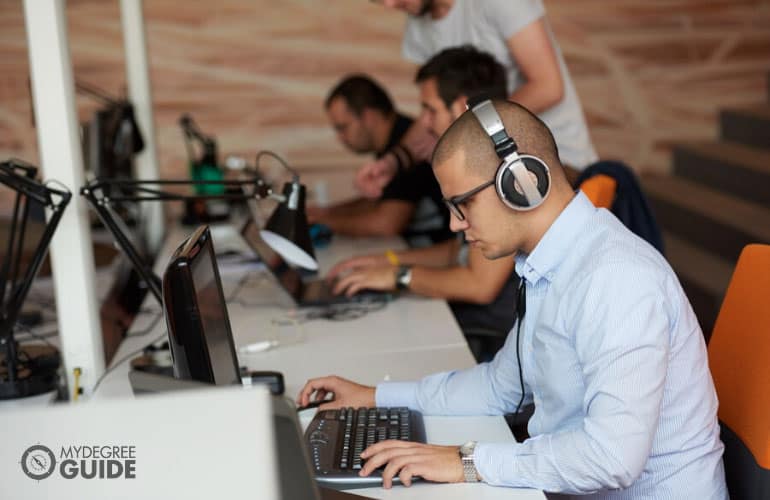 software developer working on computer at an office