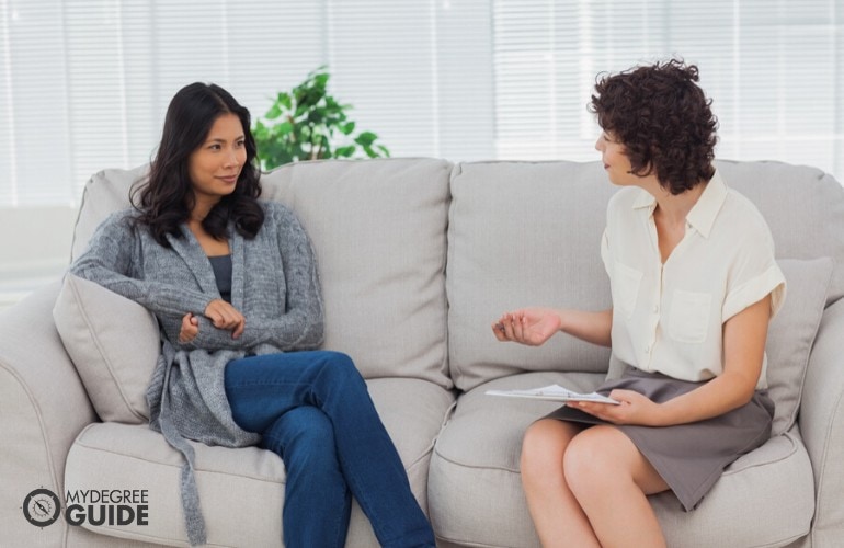 counselor talking to a patient in her office