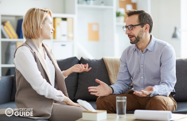 counselor talking to a patient in her office