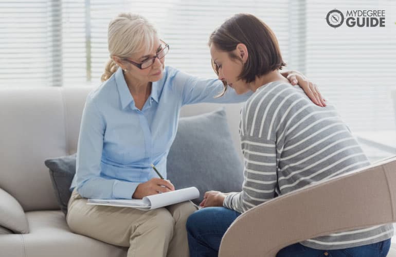 counselor comforting her patient in the office