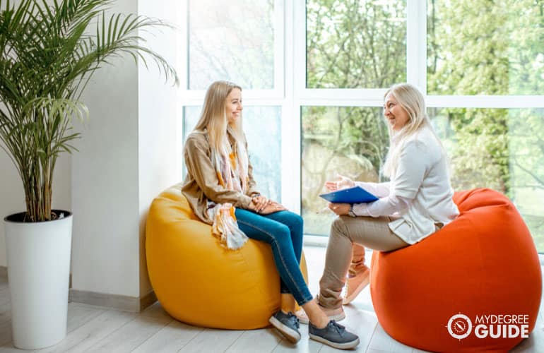 counselor and patient talking in her office