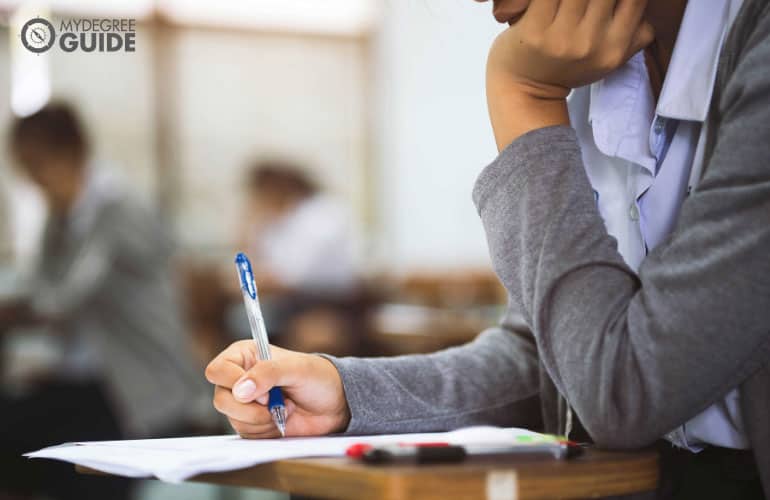 female student taking an exam