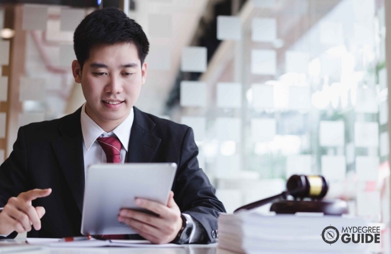 man studying a case on his tablet