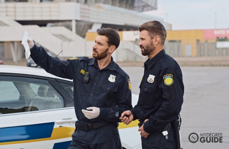 police officers checking evidences on a street accident