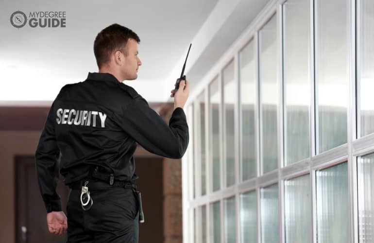 security guard walking around a building