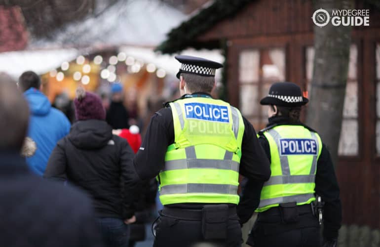 police in hi-visibility jackets policing crowd control