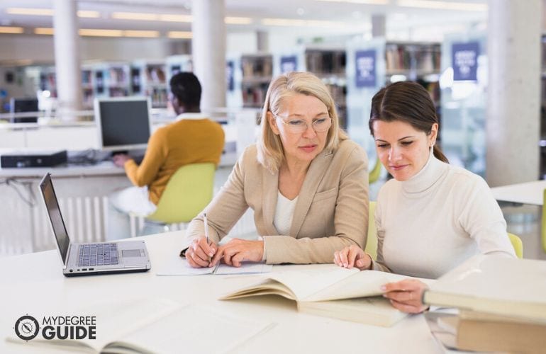 doctorate of education student reading in the library