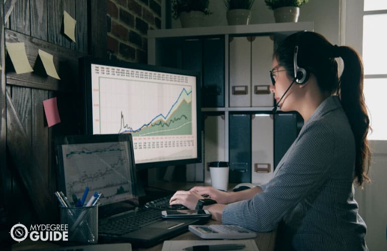 female data analyst working on her computer