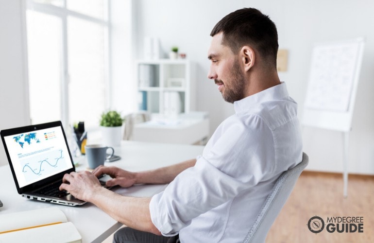 data analyst working in his office