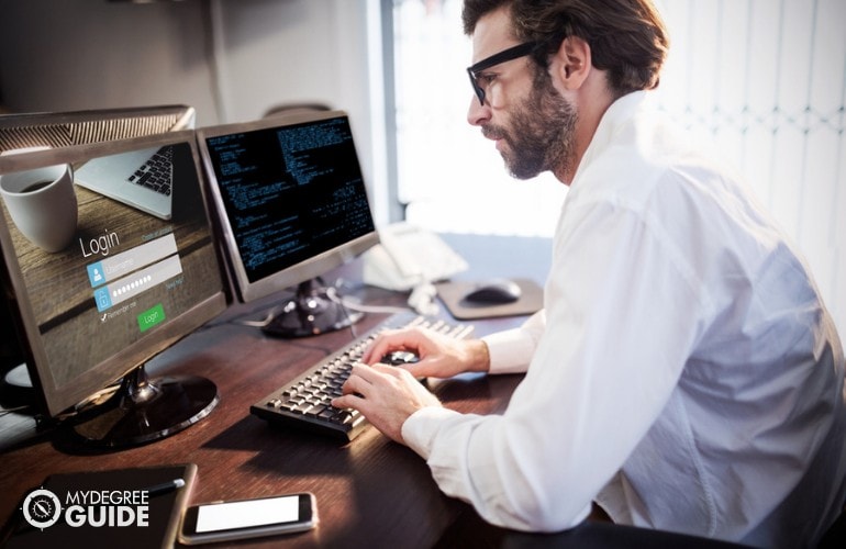 Software Developer working on his computer