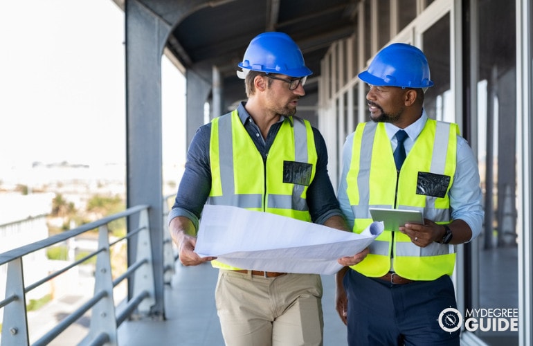 construction managers discussing at work