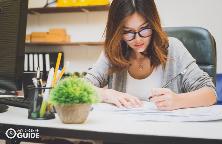 female financial advisor working on her office