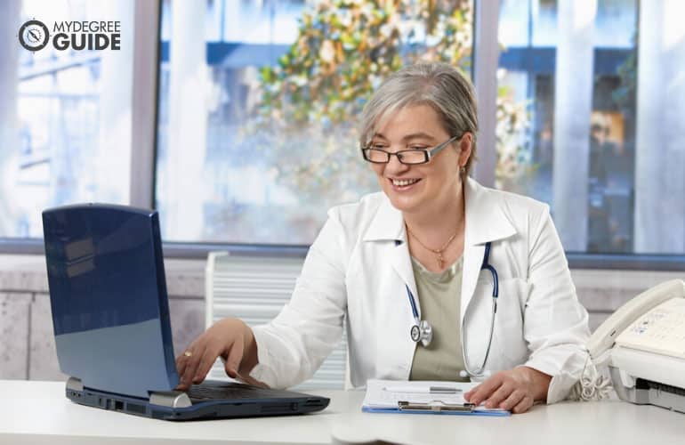 healthcare administrator working on her laptop