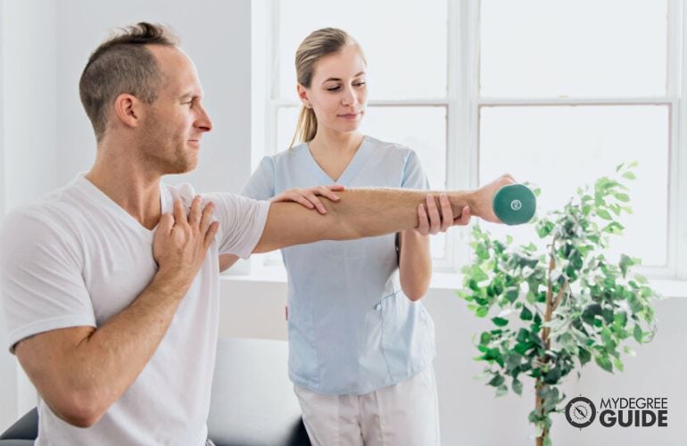 Occupational Therapist guiding her patient