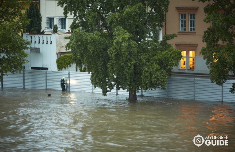 someone checking the community safety during flood