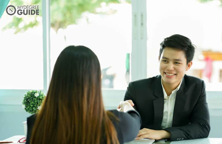 people shaking hands after an interview