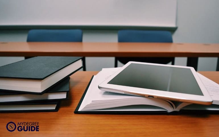 psychology books and ipad on the table