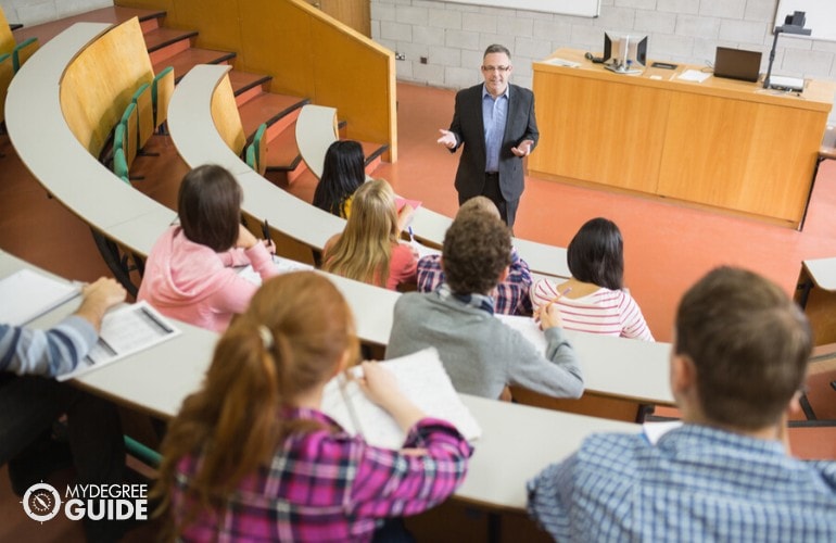 professor discussing to students in university