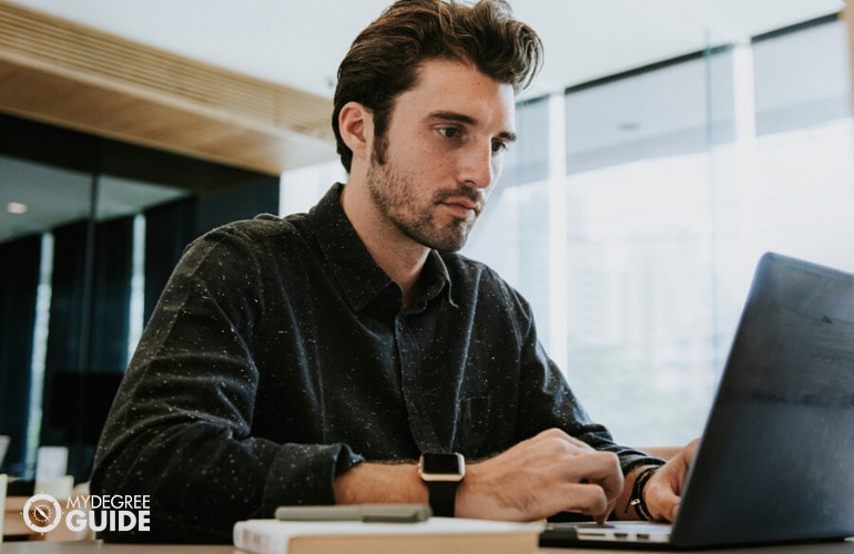 Man completing his Biology PhD degree online