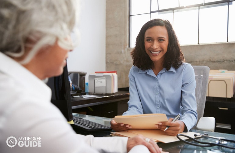 Management Analyst talking to a client