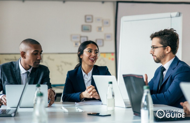 Project Manager meeting colleagues