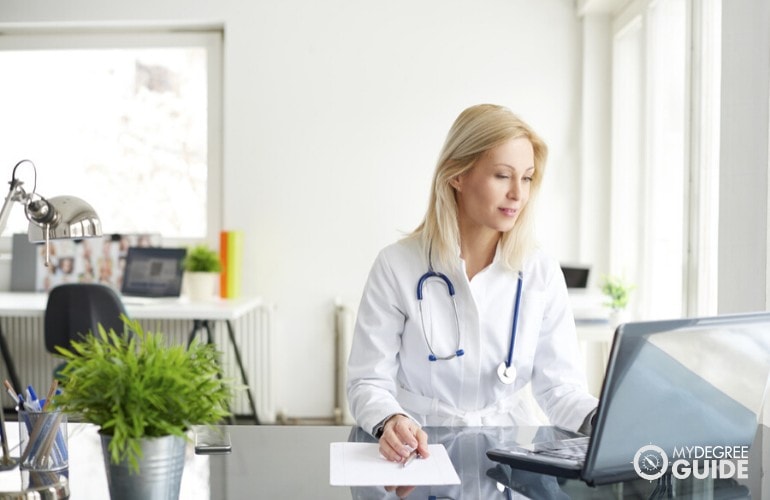 Public Health doctor studying in her office