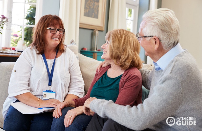 Social worker visiting an elderly couple