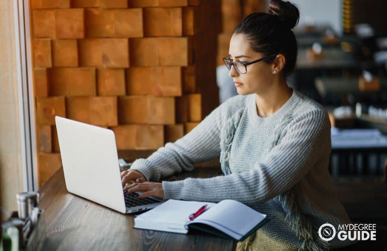 student studying on her computer