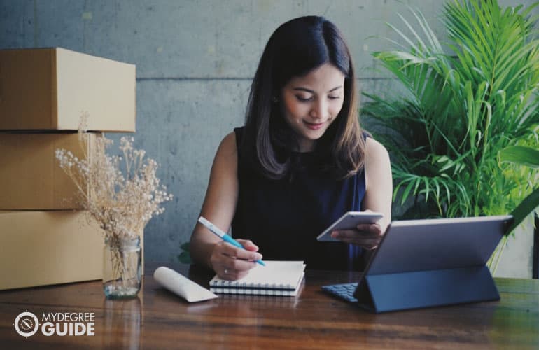 female entrepreneur working on her phone