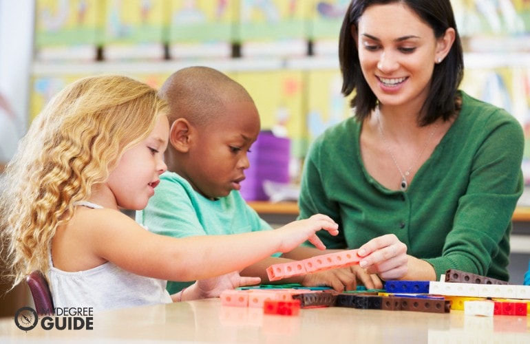 Preschool Teacher playing with her students