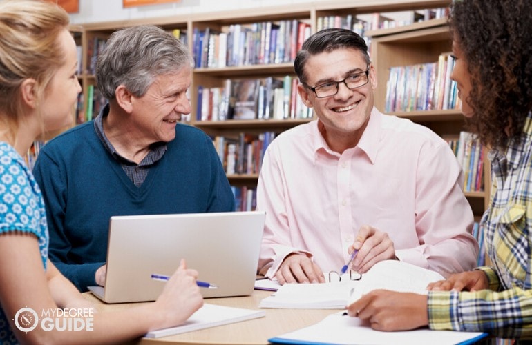 PhD in Psychology students studying in library