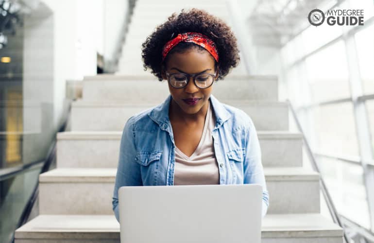 social work student studying on her laptop