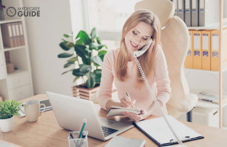 female manager of financial company talking to a client on the phone