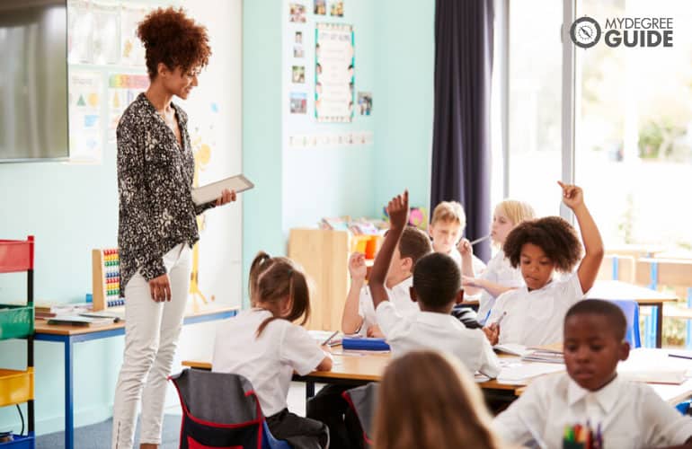 pre-school teacher with her students