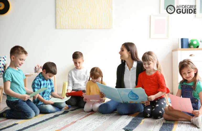 early education teacher reading a story