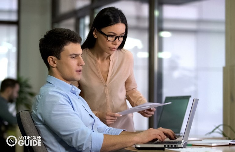 business administrators working in the office