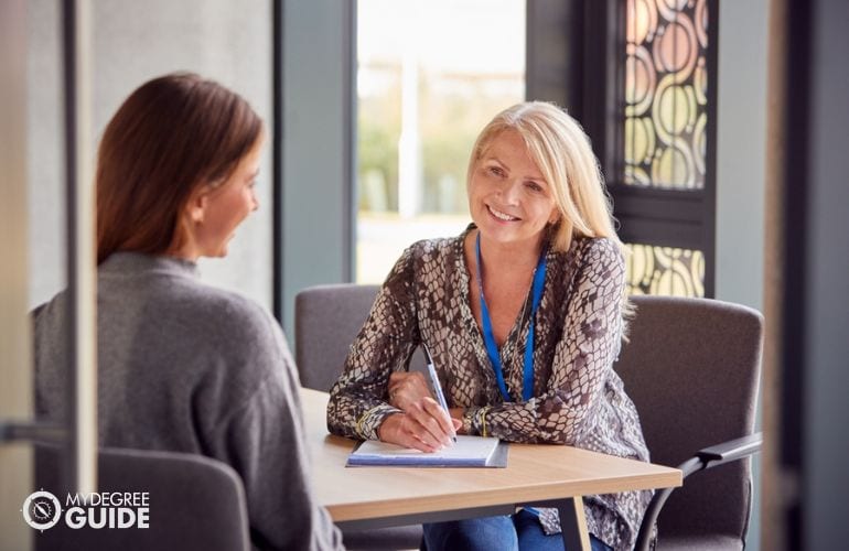 educational counseling student meeting with professor