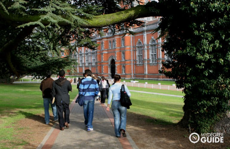 students walking into college building