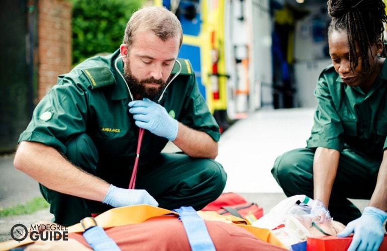 first aid responders assisting a patient